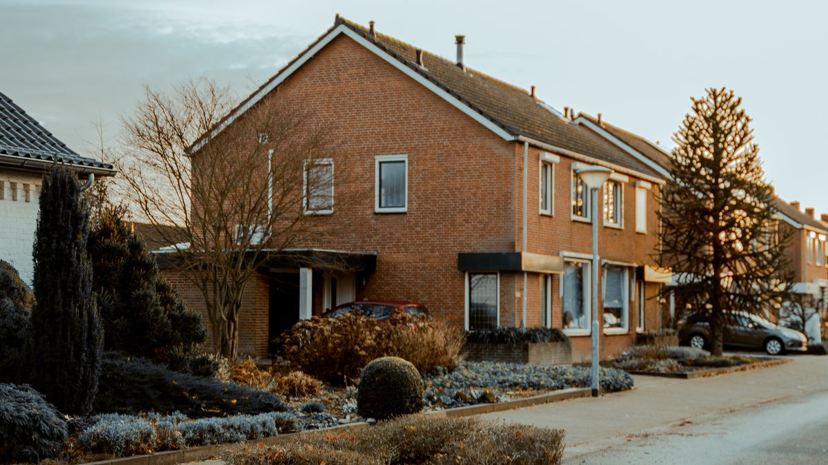 A row of British brick terraced houses on a residential street, illustrating an article on choosing a UK mortgage term length