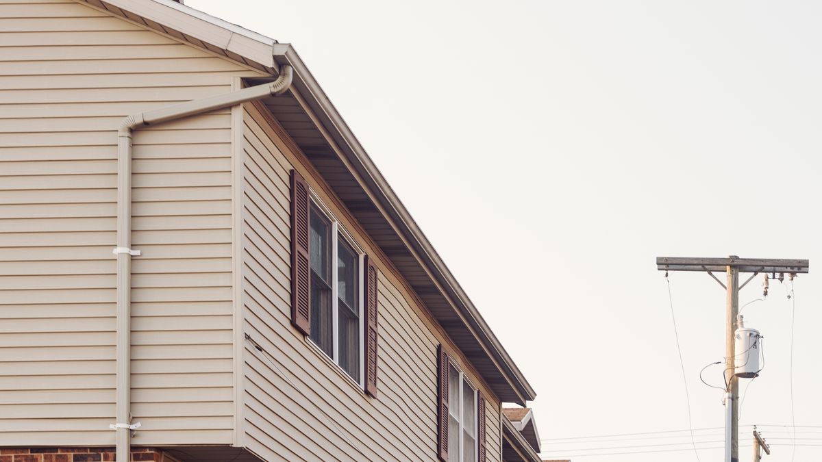 A row of modern suburban homes, illustrating an article on how much you can borrow for a mortgage in New Zealand