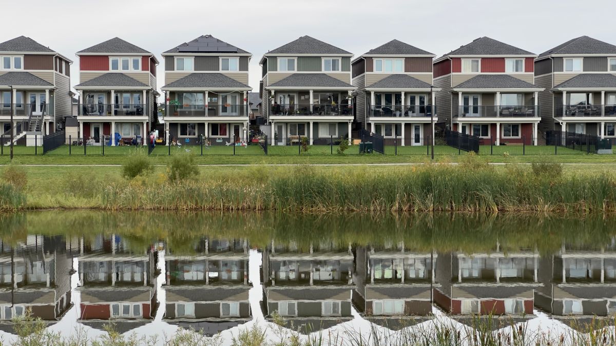 Modern detached homes on a quiet street, illustrating an article on Canada's 2026 mortgage renewal wave